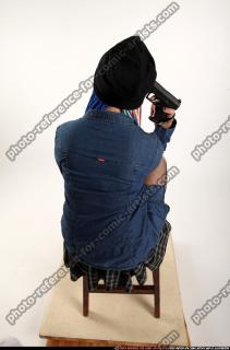 Dolores Sitting Pistol Pose