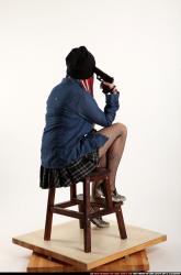 Dolores Sitting Pistol Pose