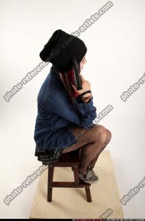 Dolores Sitting Pistol Pose