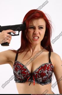 Nina Sitting Pistol Pose