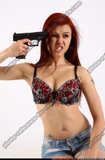 Nina Sitting Pistol Pose