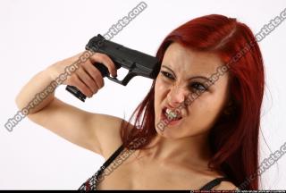 Nina Sitting Pistol Pose