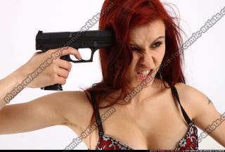 Nina Sitting Pistol Pose